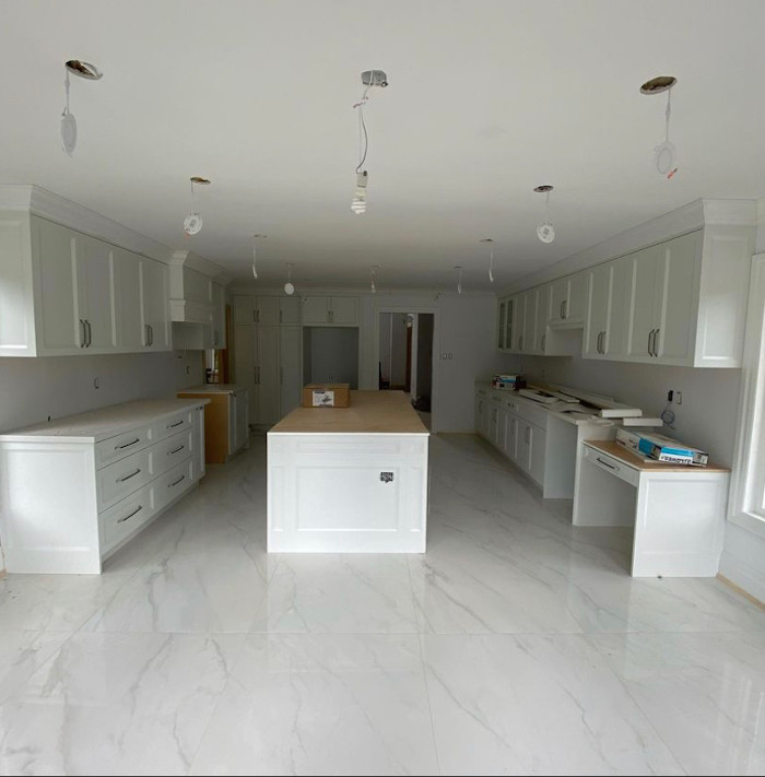 white kitchen with marble floor view 2